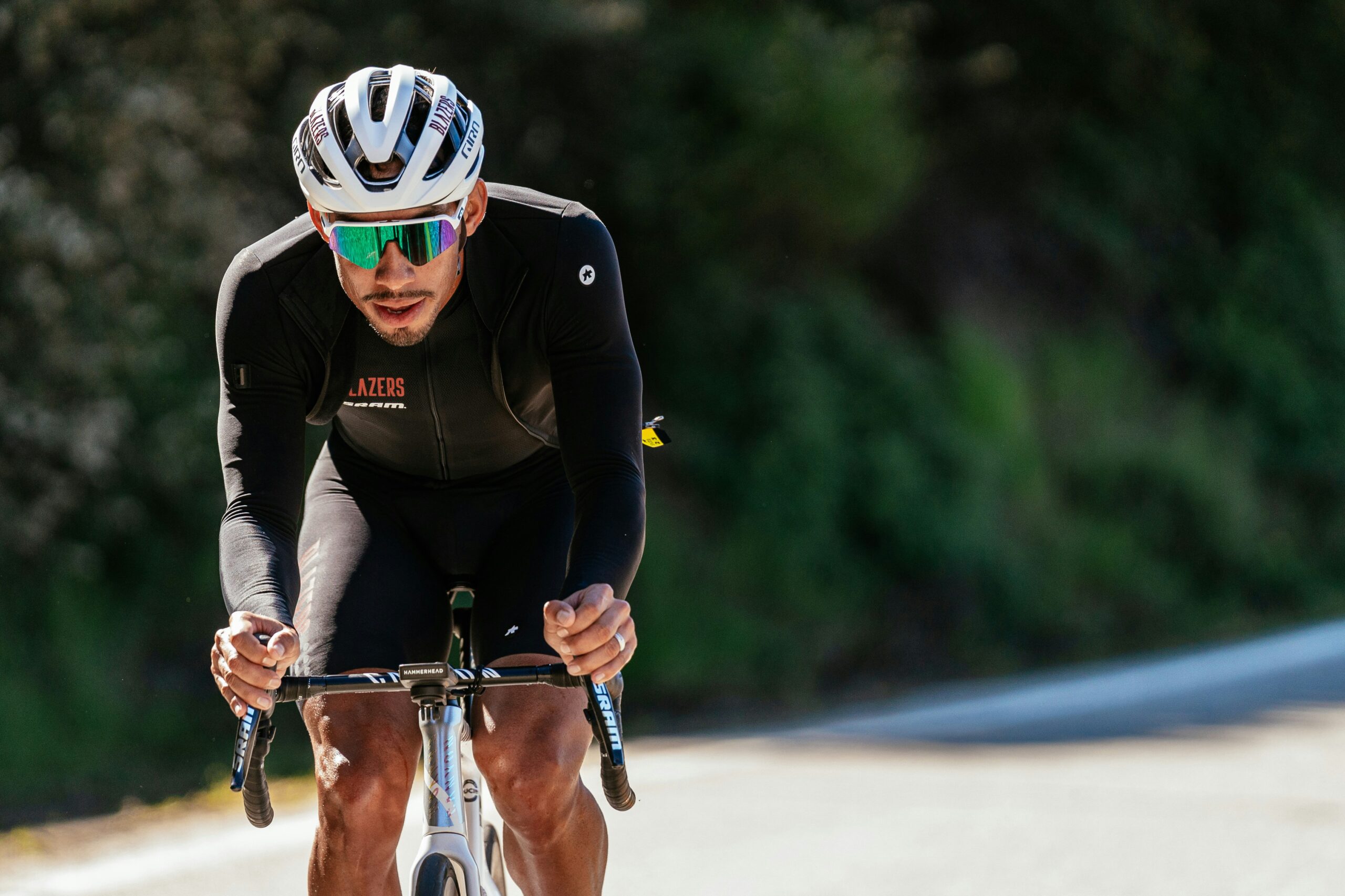 Cyclist wearing a road helmet while riding outdoors