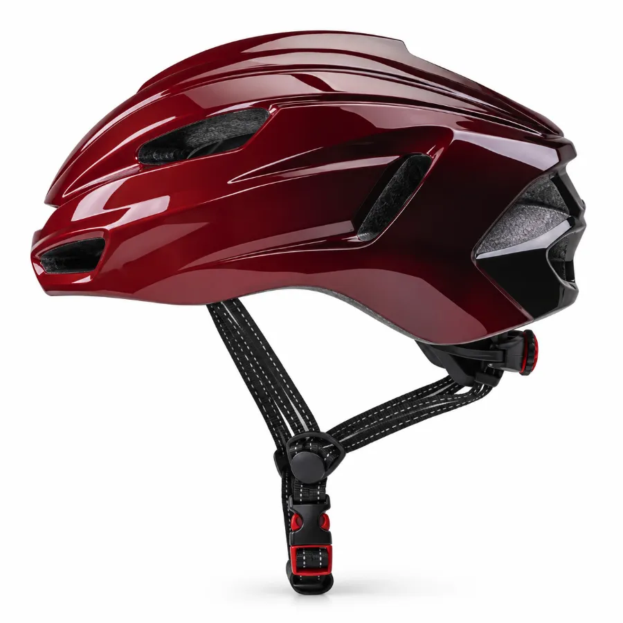 Side view of a glossy red cycling helmet with ventilation slots, black adjustable chin strap, and red buckle on white background